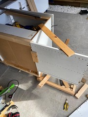 Building the fridge enclosure with temporary fixtures nailed in