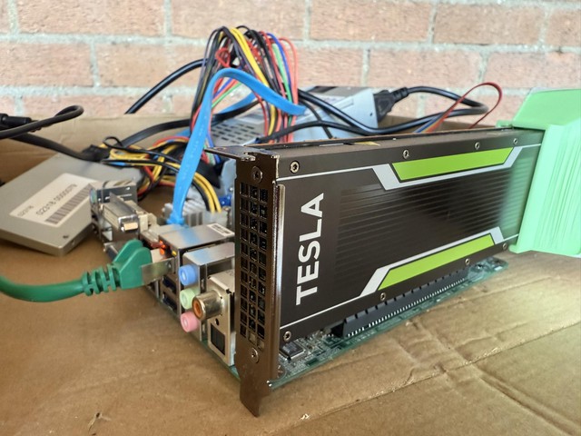 The Nvidia Tesla P4 used for training, complete with 40mm fans with a 3d-printed bracket